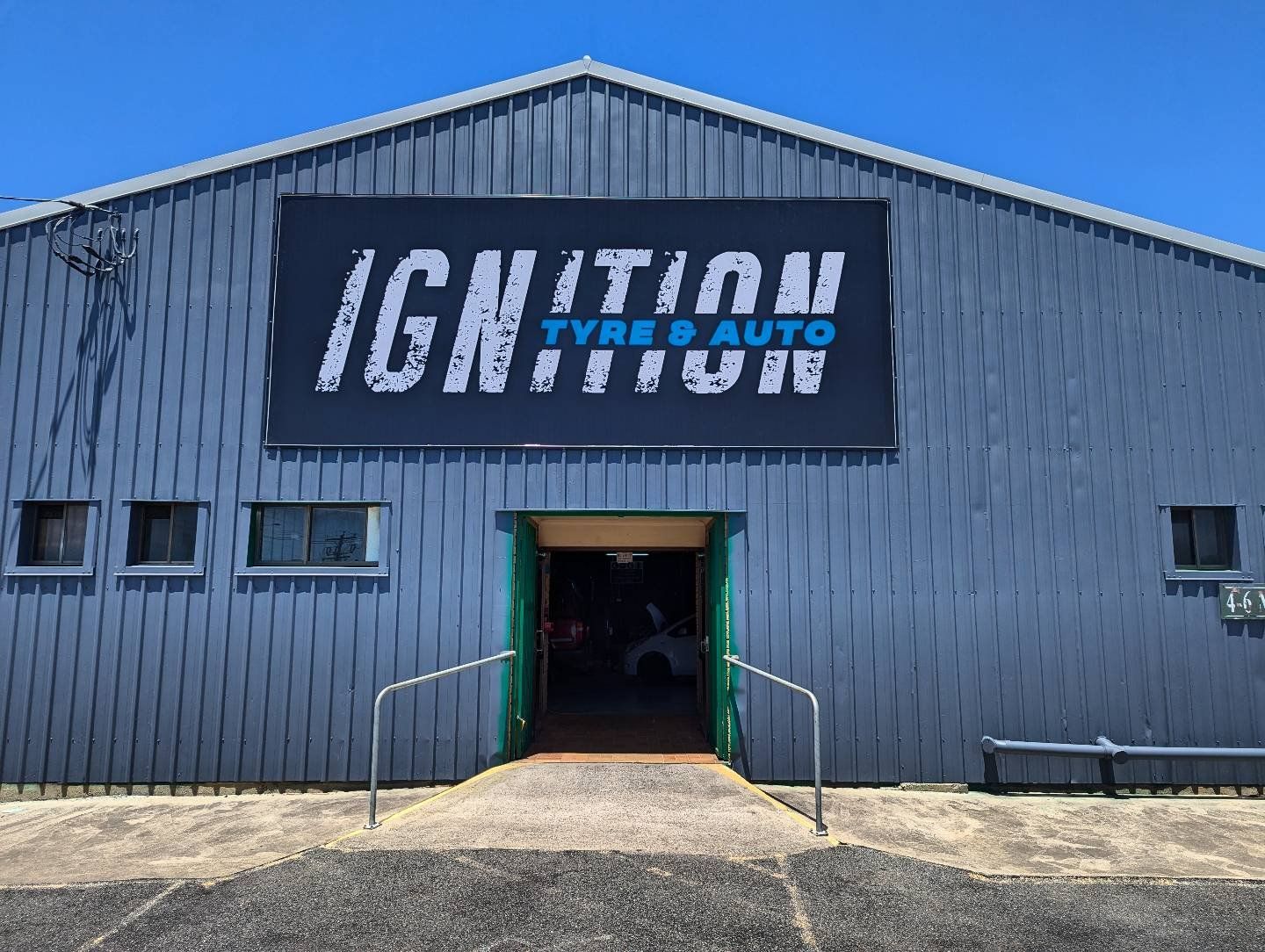 The Ignition Tyre and Auto workshop on McBean Street, Yeppoon, with the roller door open