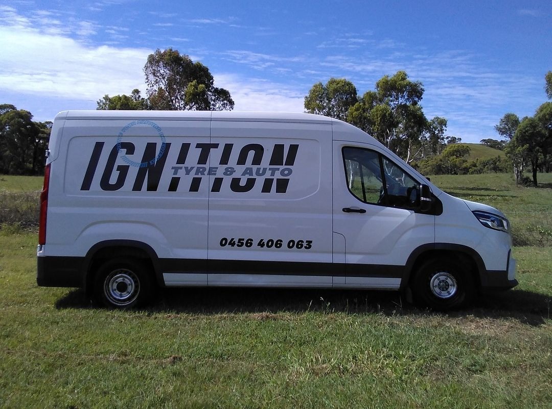 The Ignition Tyre and Auto service van, side on, with the business name and phone number on the flank